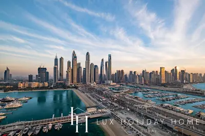a view of a city skyline with a harbor at LUX The Luxury Sunrise Beachfront Suite 2 in Dubai