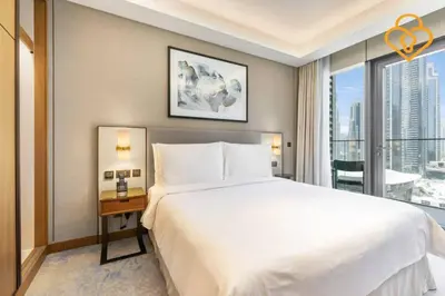 a bedroom with a large bed and a large window at Keysplease 2BR Apt Address Opera Minutes to Dubai Mall, Downtown 29 in Dubai