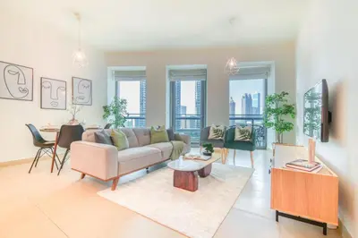 a living room with a couch and a table at Burj Vista Tower 1 - City View, Downtown Dubai - Mint Stay in Dubai