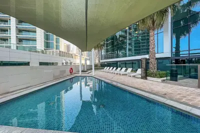a swimming pool in the middle of a building at Frank Porter - The Address JBR in Dubai
