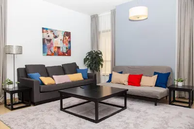 a living room with two couches and a coffee table at Shams Apart on JBR - 1 Bedroom - Marina View in Dubai
