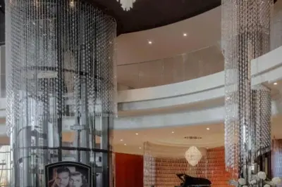 a room with a bunch of silver curtains at Keysplease Luxury 1 B/R Apt in Paramount Towers by Damac in Dubai