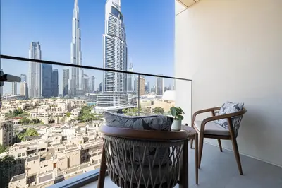 a room with a window with a view of a city at Burj Royale Residences Downtown Dubai - Burj Khalifa District in Dubai