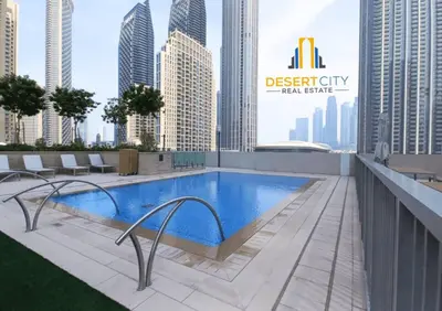 a swimming pool on the roof of a building at Fully Furnished 1 Bed in Downtown Dubai, Hosted by Desert City Stays in Dubai