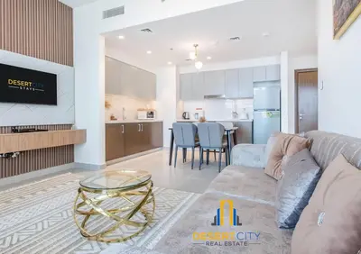 a living room with a couch and a dining room at Fully Furnished 1 Bed in Downtown Dubai, Hosted by Desert City Stays in Dubai