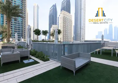 a rooftop patio with furniture and a city skyline at Fully Furnished 1 Bed in Downtown Dubai, Hosted by Desert City Stays in Dubai