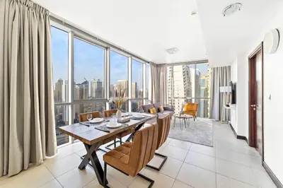 a dining room with a table and a large window at StoneTree - Indigo Tower 1BR - Panoramic View in Dubai