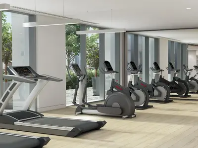 a row of exercise bikes in a gym at Burj Royale, Downtown Dubai - Mint Stay in Dubai