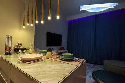 a kitchen with a table with a bowl on top of it at VIDA Premier Deluxe - Creek Beach - Beachfront Bliss in Dubai