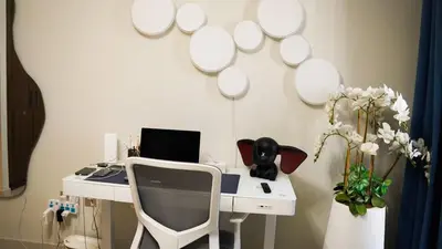 a white desk with a computer and a chair at VIDA Premier Deluxe - Creek Beach - Beachfront Bliss in Dubai