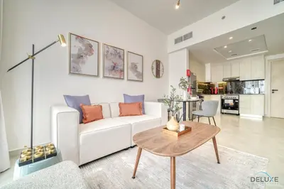 a living room with a white couch and a table at Soothing 1BR at Binghatti Avenue Al Jaddaf by Deluxe Holiday Homes in Dubai