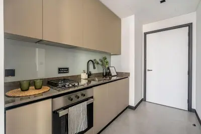 a kitchen with a stove and a sink at GuestReady - Lux comfort in Business Bay in Dubai