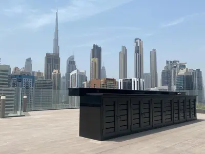 a black counter on top of a building with a city skyline at GuestReady - Lux comfort in Business Bay in Dubai