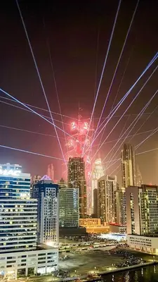 a view of a city skyline at night at GuestReady - Lux comfort in Business Bay in Dubai