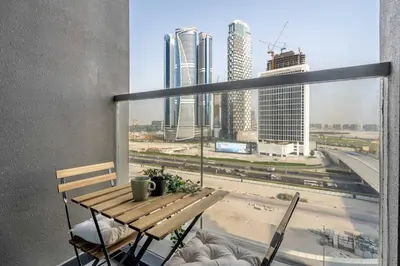 a balcony with a table and a view of a city at GuestReady - Lux comfort in Business Bay in Dubai