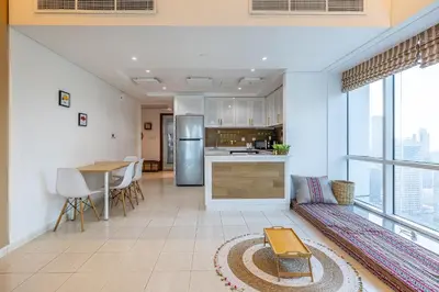 a kitchen and dining room with a large window at Lake Terrace I JLT I 1 Bedroom Apartment in Dubai