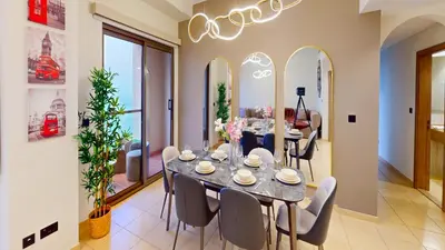 a dining room with a table and chairs at Amazing views Dubai eye & Palm in Dubai