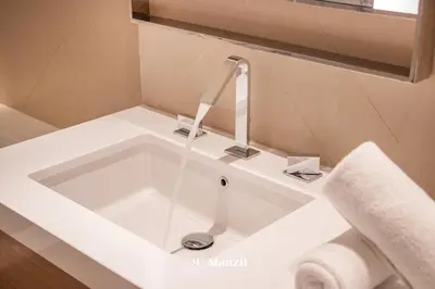 a sink with a faucet in a bathroom at Address Opera - Lux 3 BR with Full Burj Khalifa View near Dubai Mall in Dubai
