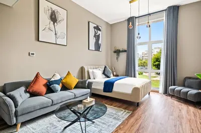 a living room with a bed and a couch at Luxury apartment at Discovery in Dubai