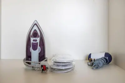 a small rocket sitting next to a stack of plates at StoneTree - Modern Style of Studio in Resortz by Danube in Dubai