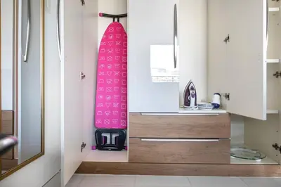 a surfboard is sitting on a wall in a kitchen at StoneTree - Modern Style of Studio in Resortz by Danube in Dubai