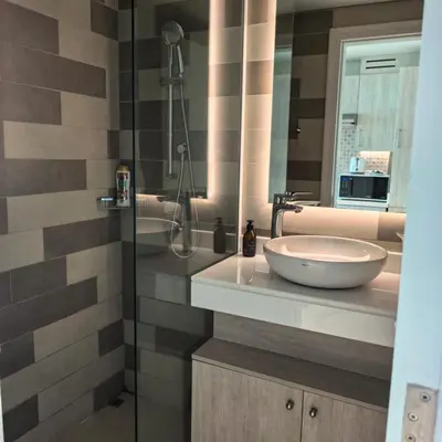 a bathroom with a sink and a glass shower at 7 Palm Jumeirah in Dubai