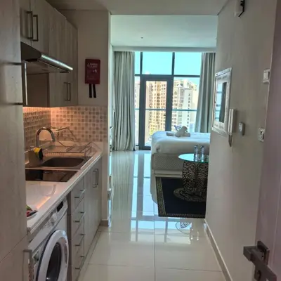 a kitchen with a sink and a table in it at 7 Palm Jumeirah in Dubai