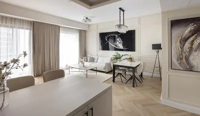 a living room with a couch and a table at Beautiful stylish 1 bedroom by the JBR beach ! in Dubai