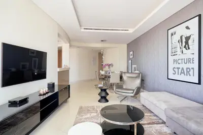 a living room with a couch and a table at ALiving Supreme 3BR I Paramount Towers, Business Bay- 6104 in Dubai