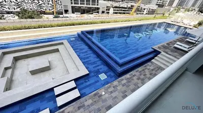 a swimming pool on top of a building at Contemporary 1BR at Vera Tower Business Bay by Deluxe Holiday Homes in Dubai