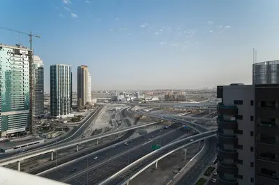 a view of a highway in a city with buildings at StoneTree - Fully Furnished 1BR near Metro Station in Dubai
