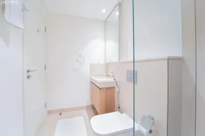 a bathroom with a shower and a toilet and a sink at Downtown Views II Tower 1 brand new units in Dubai