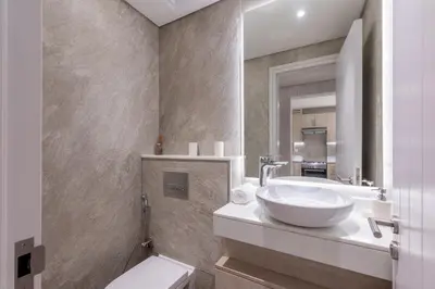 a bathroom with a sink and a toilet at Seven Palm, Palm Jumeirah - Mint Stay in Dubai