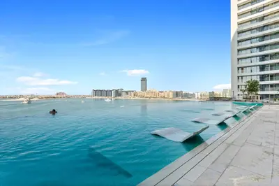 a swimming pool in the middle of a city at Palm View Paradise 3 bed apartment w private beach in Dubai