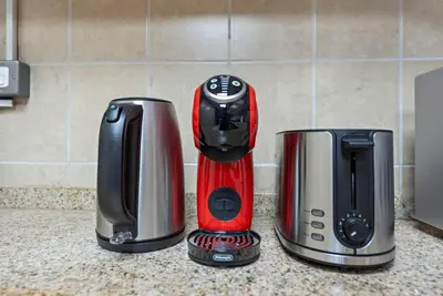 two toasters sitting on a kitchen counter at StoneTree - NEW Furnished 1BR in V3 Tower in Dubai