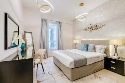 a bedroom with a large bed and a mirror at GlobalStay 3 Bedroom Apartment near JBR Beach Dubai Marina in Dubai