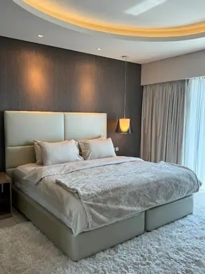 a bedroom with a large bed in a room at ROYAL APARTMENTS By Damac Paramount Towers B Burj Khalifa Views in Dubai