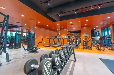 a gym with lots of equipment in a room at Azure Escape !Joyful 1 Bed Apartment close to the Sea! in Dubai