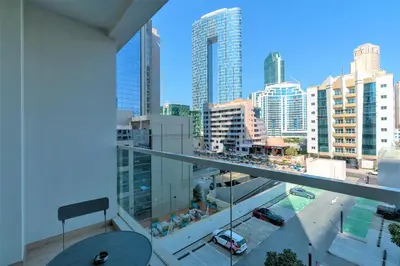 a view of a city from the balcony of a building at Stunning Apt with Balcony & Marina View in Dubai