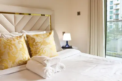 a hotel room with a bed with towels on it at Celestial Ambiance Studio in Dubai