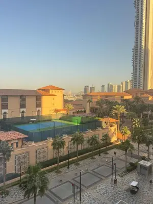 an aerial view of a city with buildings and palm trees at Upscale 3br in JBR next to Ritz-Carlton in Dubai