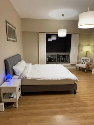 a bedroom with a large bed and a tv at Upscale 3br in JBR next to Ritz-Carlton in Dubai