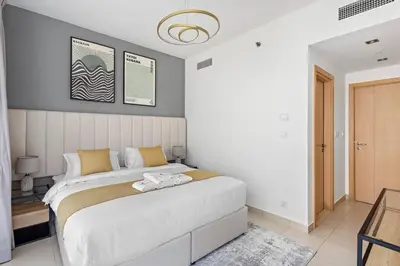 a bedroom with a large bed in a room at StoneTree - Stylish fully-furnished 1 BR in Dubai