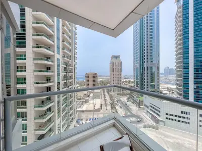 a balcony with a view of a city with tall buildings at StoneTree - Amazing View - Modern 1BR in Dubai