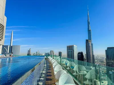 a swimming pool on the top of a skyscraper at Luxury Apartments with Rooftop Pool in Paramount Hotel Midtown By Aurora in Dubai