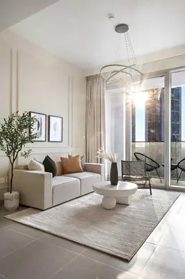 a living room with a couch and a table at Silkhaus classical 1BDR in Opera District in Dubai