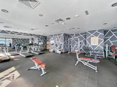 a gym with exercise equipment in a room at StoneTree - Chic & Modern 1BR in Dubai