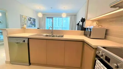a kitchen with a sink and a counter top at Luxurious Creek Harbour Apt with Balcony & View in Dubai