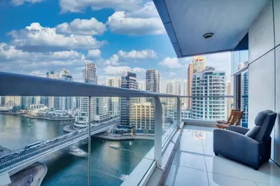 a balcony with a view of a river and buildings at Cozy Heaven with full Marina View in Dubai