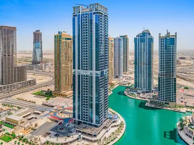 an aerial view of a city with a river and buildings at StoneTree - New stylish 1 BR Apartment in JLT in Dubai
